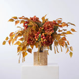 Golden Hour Fall Hydrangea, Birch Leaf, Orange Crater Berry & Yellow Astilbe Water Illusion Arrangement in Rattan Vase