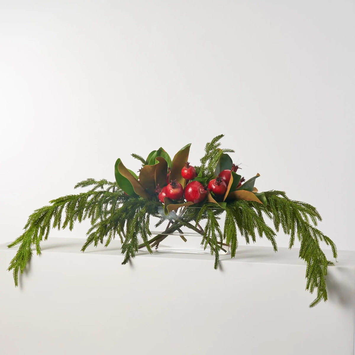 Lifelike Red Pomegranate, Real Touch Magnolia Leaves, & Norfolk Pine Holiday Arrangement in Oval Vase Christmas Centerpiece