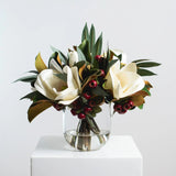 Holiday White Magnolia, Red Crabapple & Needle Leaf Eucalyptus Christmas Floral Arrangement Centerpiece in Glass Vase