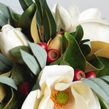 Holiday White Magnolia, Red Crabapple & Needle Leaf Eucalyptus Christmas Floral Arrangement Centerpiece in Glass Vase